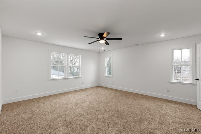 unfurnished room featuring recessed lighting, light carpet, ceiling fan, and baseboards