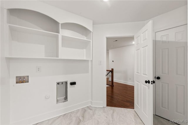 clothes washing area featuring gas dryer hookup, laundry area, washer hookup, baseboards, and marble finish floor