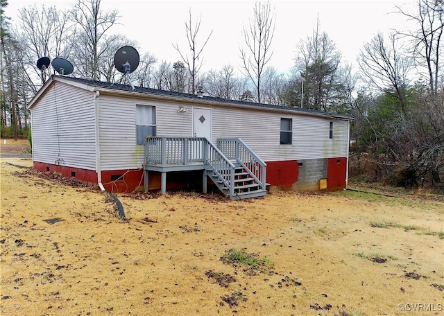 back of property featuring crawl space