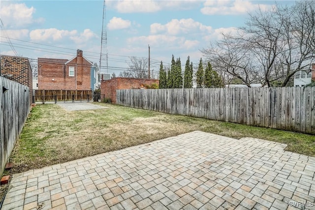 view of yard featuring a fenced backyard and a patio area