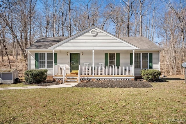 view of front of property with covered porch and a front yard