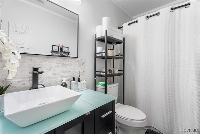 bathroom featuring toilet, a shower with curtain, crown molding, and vanity