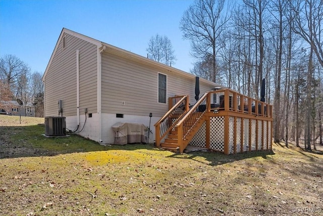 rear view of house featuring stairs, a yard, a deck, and central air condition unit