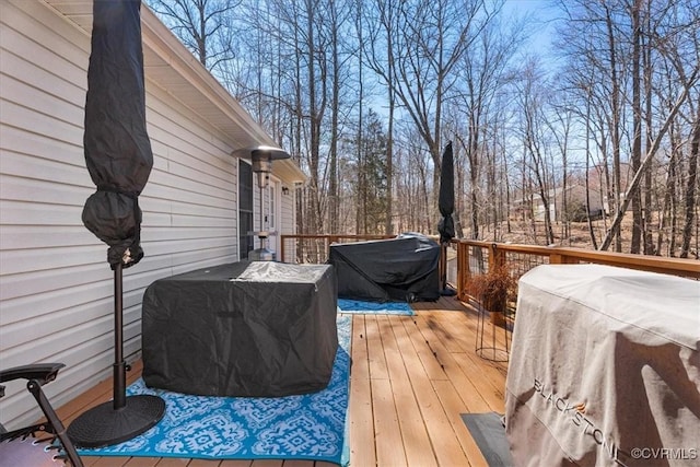 wooden deck featuring grilling area