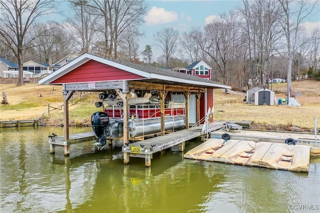 view of dock featuring a water view and boat lift