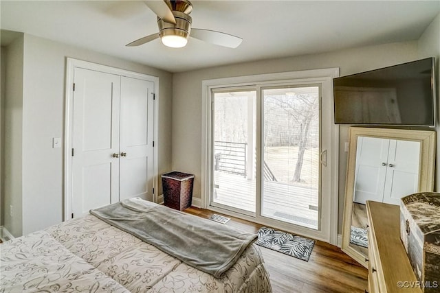 bedroom with ceiling fan, access to outside, a closet, and wood finished floors