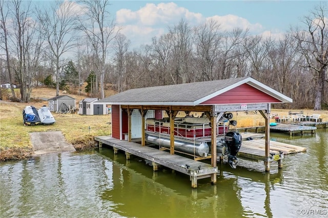 dock area featuring a water view and boat lift