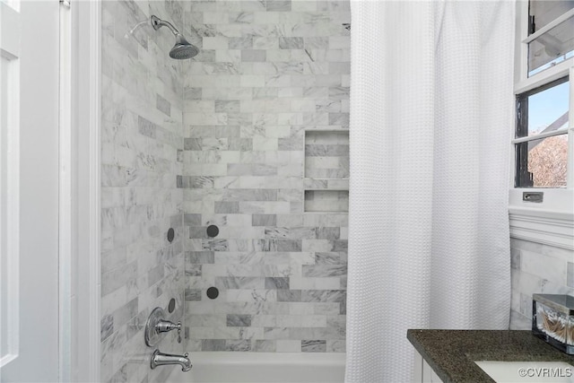 full bath with vanity and shower / bathtub combination with curtain