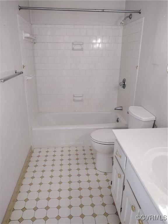 bathroom with toilet, tub / shower combination, and vanity