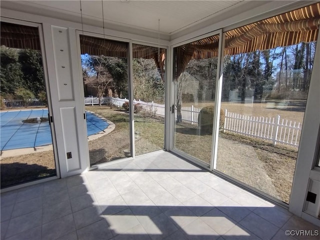 unfurnished sunroom with plenty of natural light