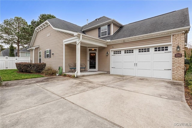 view of front of house with driveway, a porch, fence, roof with shingles, and an attached garage