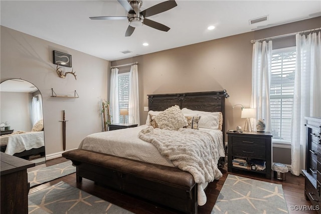 bedroom featuring recessed lighting, multiple windows, dark wood-style floors, and visible vents