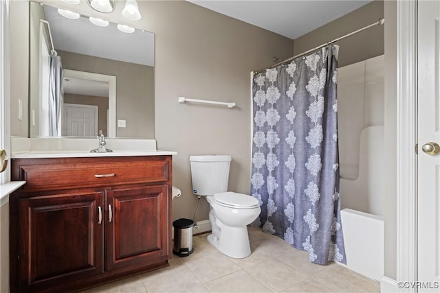 full bath with toilet, vanity, shower / tub combo with curtain, and tile patterned floors