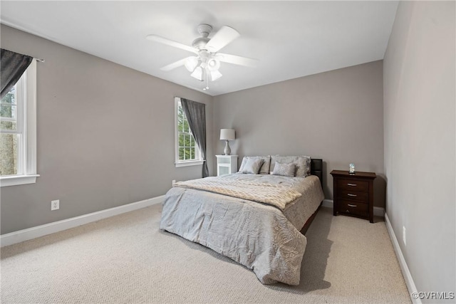 bedroom with carpet floors, ceiling fan, and baseboards