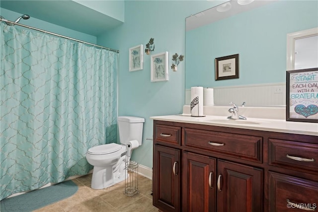 full bathroom with a shower with curtain, vanity, toilet, and tile patterned floors