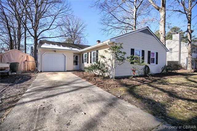 ranch-style house featuring a garage and concrete driveway