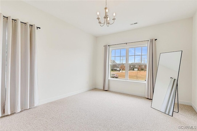 empty room featuring baseboards, visible vents, light carpet, and an inviting chandelier