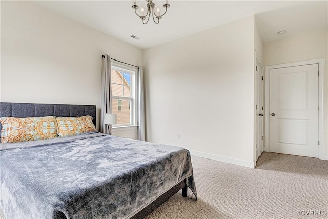 bedroom with a notable chandelier, carpet, visible vents, and baseboards