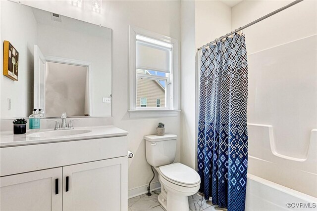 full bath featuring toilet, marble finish floor, shower / bath combination with curtain, baseboards, and vanity