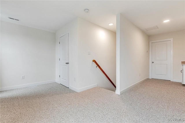 spare room featuring recessed lighting, visible vents, baseboards, and light colored carpet