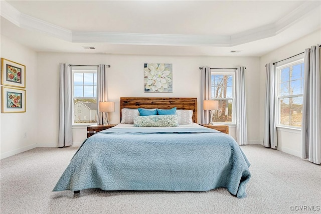 bedroom featuring a raised ceiling, carpet, and visible vents