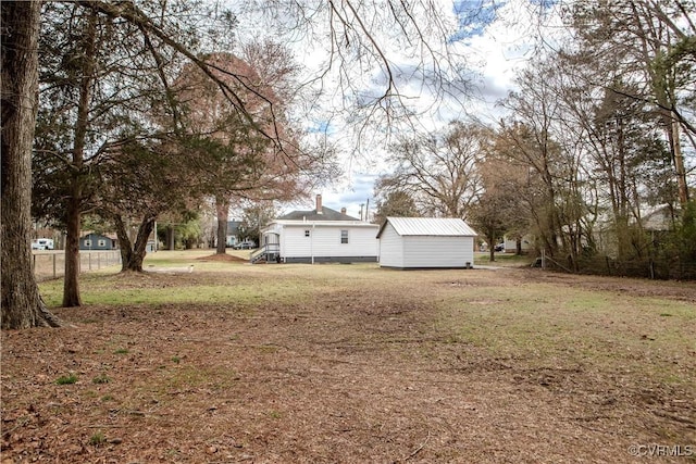 view of yard with a storage unit and an outdoor structure