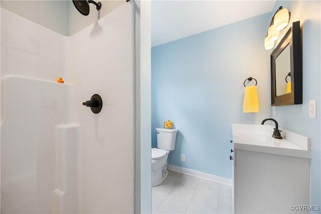 bathroom with toilet, baseboards, walk in shower, and vanity