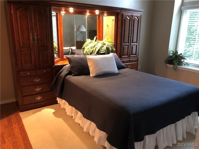 bedroom featuring wood finished floors