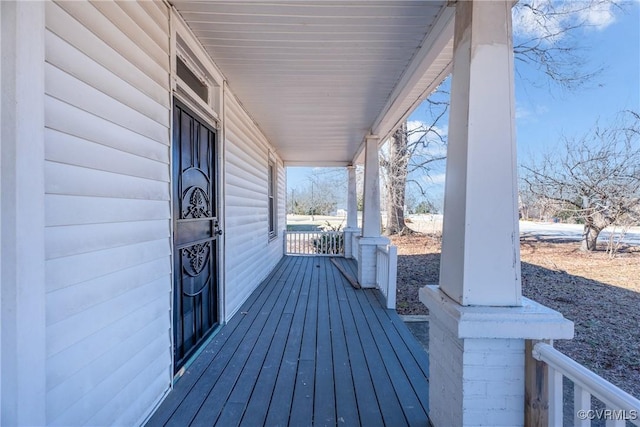 wooden deck featuring a porch