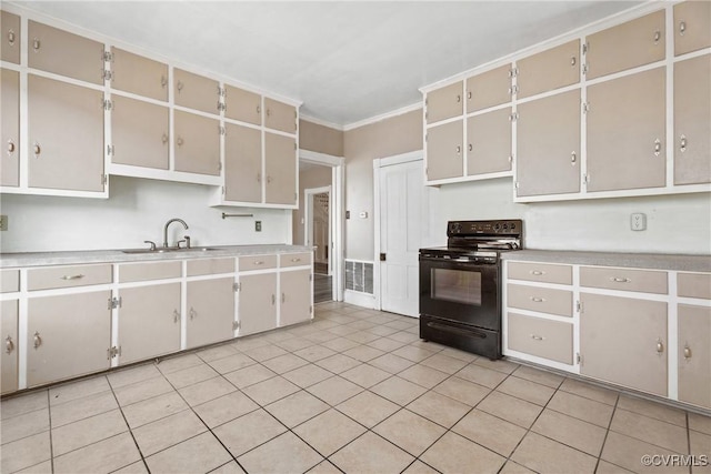 kitchen featuring ornamental molding, black electric range, light countertops, and a sink