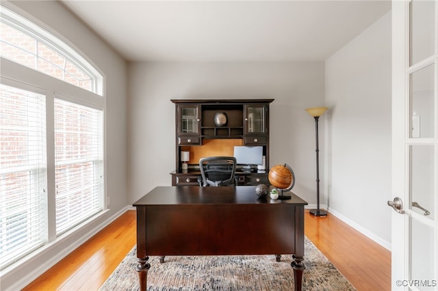 office space featuring light wood finished floors and baseboards