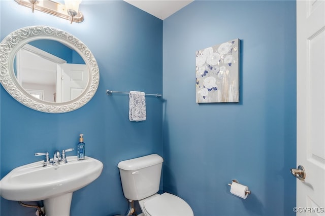 bathroom with a sink and toilet