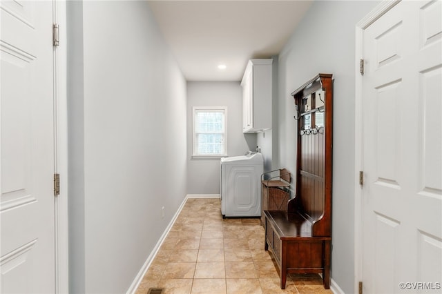 washroom with washer / dryer, light tile patterned floors, cabinet space, baseboards, and recessed lighting