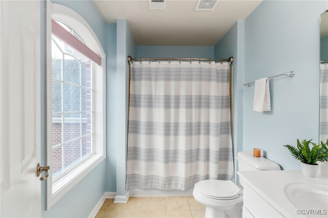 full bath with visible vents, a healthy amount of sunlight, vanity, and tile patterned floors