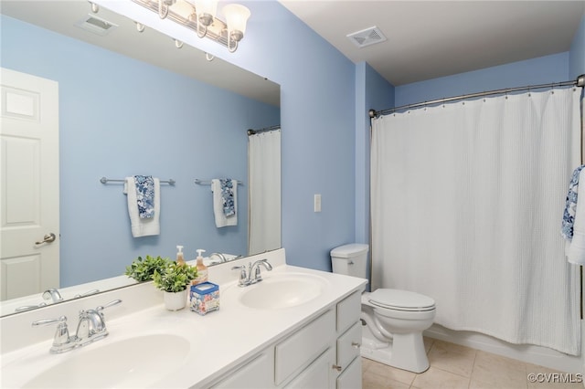 bathroom with visible vents, a sink, and tile patterned floors