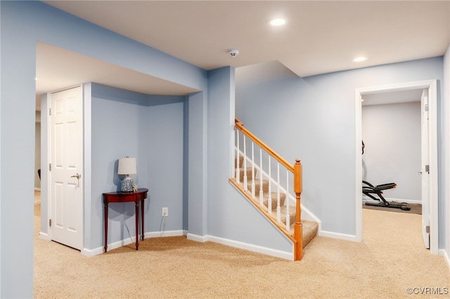 hall with carpet, stairway, baseboards, and recessed lighting