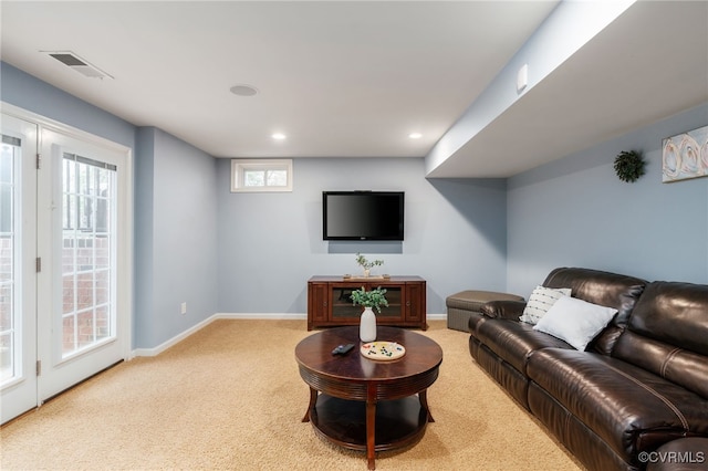 carpeted living room featuring recessed lighting, visible vents, and baseboards