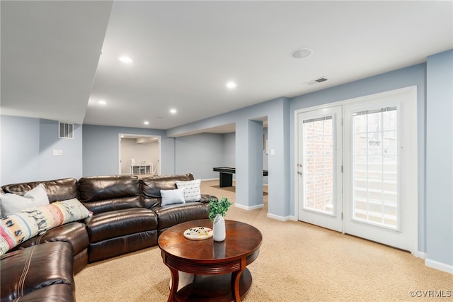 living area with light colored carpet, visible vents, baseboards, and recessed lighting