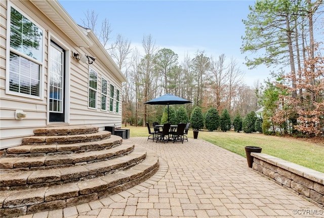 view of patio featuring entry steps and outdoor dining area