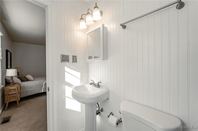 bathroom featuring toilet and visible vents