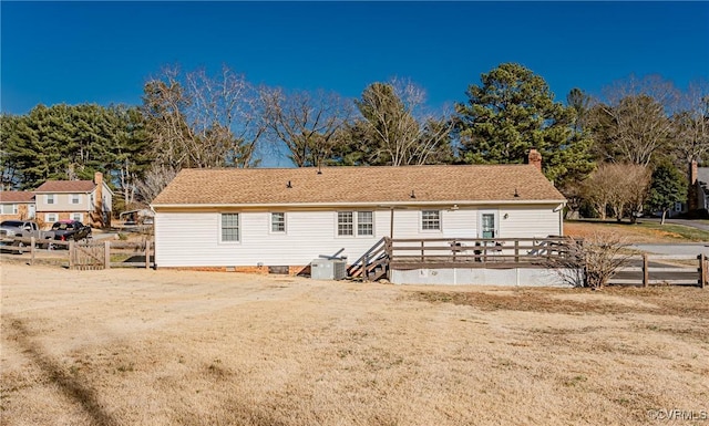 back of property with crawl space, a chimney, fence, and a deck