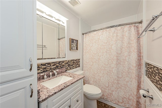 bathroom featuring toilet, vanity, visible vents, decorative backsplash, and a shower with curtain