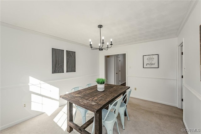 dining area featuring light carpet, ornamental molding, baseboards, and a notable chandelier