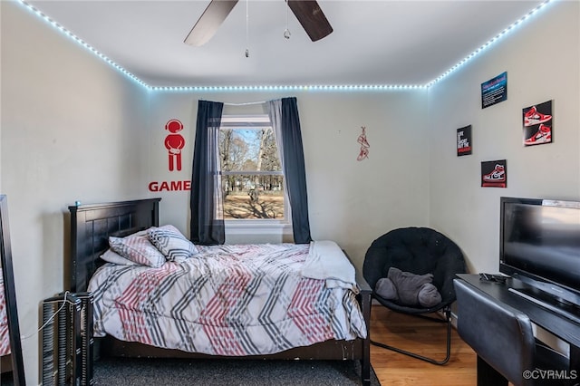 bedroom featuring ceiling fan and wood finished floors