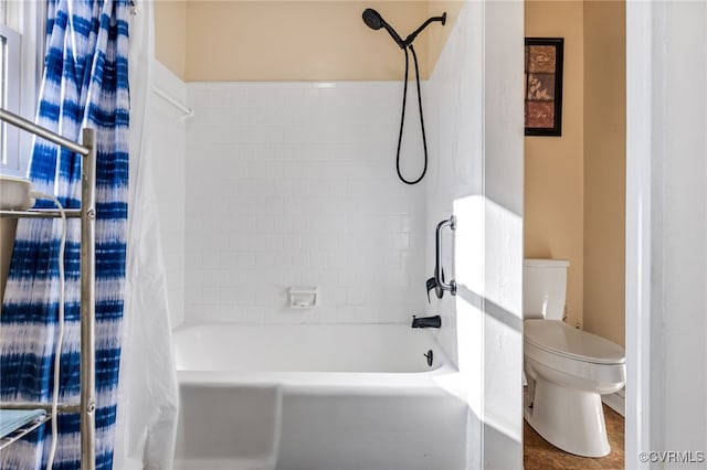 full bathroom with toilet and shower / bath combo with shower curtain