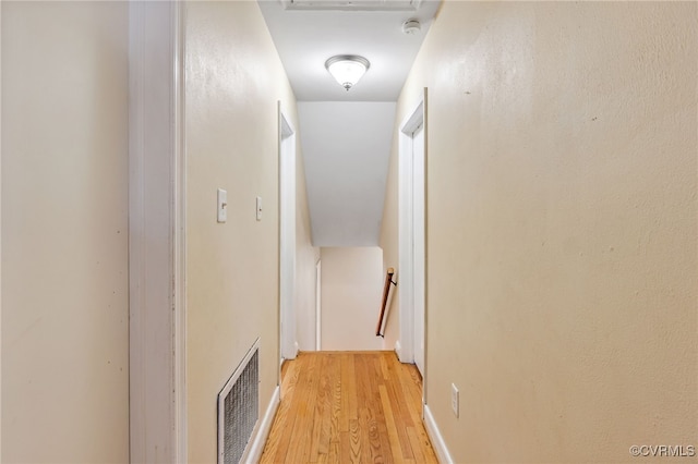 hall with light wood-style flooring and visible vents