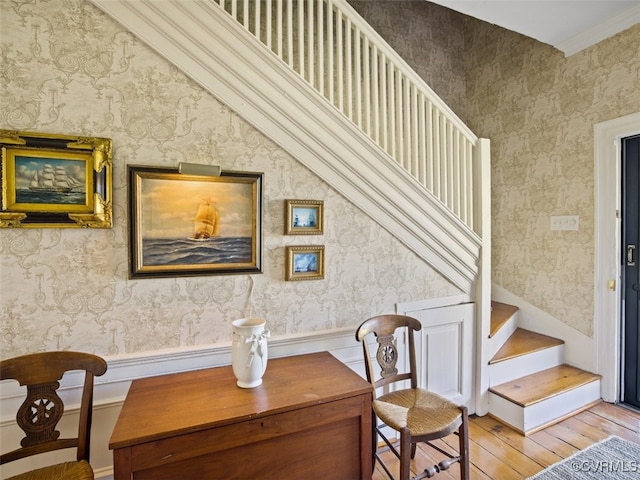 interior space with hardwood / wood-style flooring and wallpapered walls