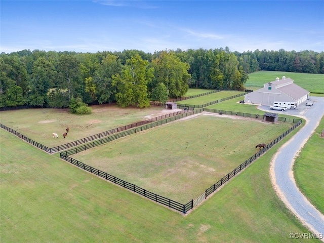 birds eye view of property with a rural view