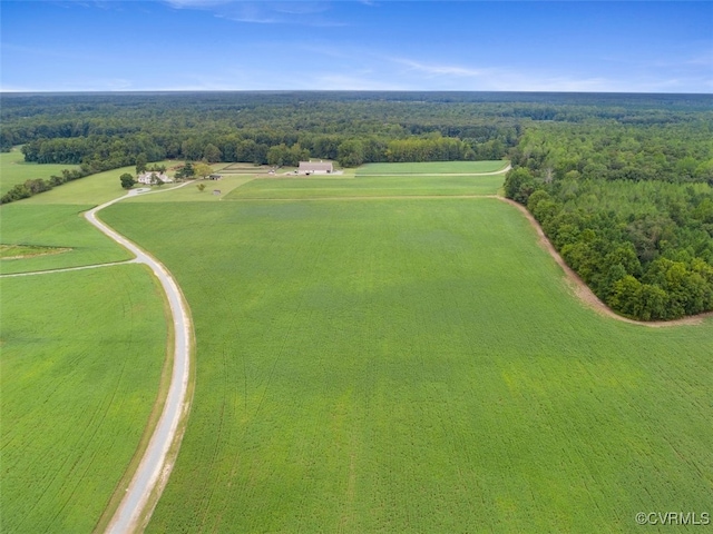 drone / aerial view featuring a view of trees