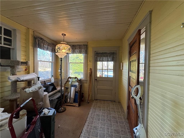 sunroom featuring wood ceiling